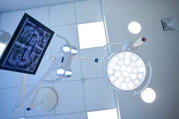 Surgical lamp and monitor with the image of dental x-ray