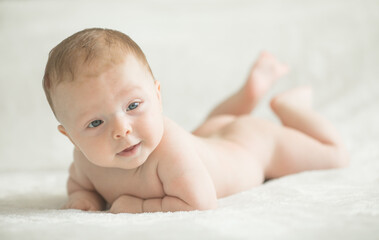 Cute little baby crawling. Family morning at home.  Beautiful smiling son. Beautiful happy child.