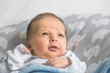 Newborn Baby Sleeping Smiling. Cute Infant Child