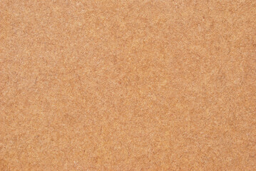 A sheet of brown recycled cardboard texture as background
