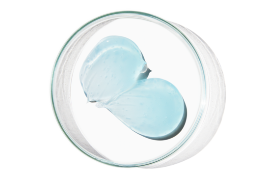 Petri dish with a drop and a smear of a transparent gel or serum on an empty background.