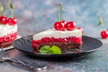 Cherry cake decorated with fresh cherries
