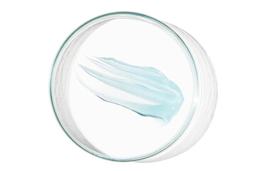 Petri dish with a drop and a smear of a transparent gel or serum on an empty background.