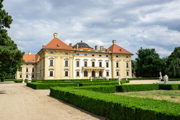Fototapeta na wymiar Slavkov Castle (Austerlitz) with a park with statues and a path, Czech Republic.