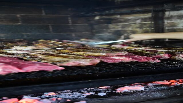 Argentinian grilled meat cooking - asado argentino