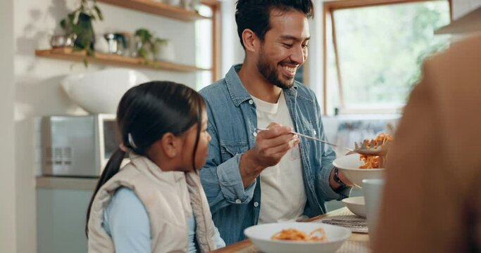 Father, kids and a girl eating spaghetti with her family in the dining room of their home together for supper. Food, children and parents around a table for a meal, bonding over dinner in a house