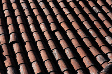 red or brown tile pattern for house roof, old house roof