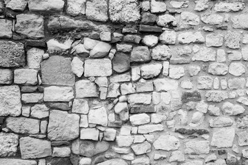 Toned art texture of old stonewall, close-up. Stone brick wall for publication, poster, calendar, post, screensaver, wallpaper, postcard, banner, cover, website. High quality photo