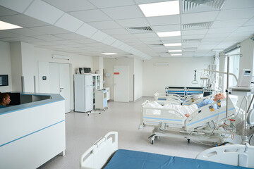 Intensive care ward with medical equipment and patient