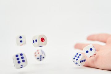 Playing dice for gambling and tabletop games, flying in air, poker isolated on white background, clipping path
