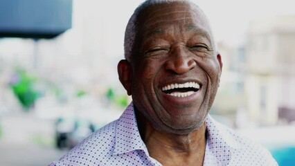 One joyful black older Brazilian person smiling. Charismatic Elderly African American close-up face with friendly disposition