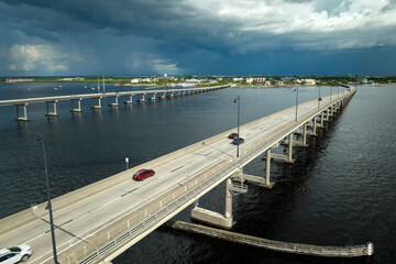 Barron Collier Bridge and Gilchrist Bridge in Florida with moving traffic. Transportation...