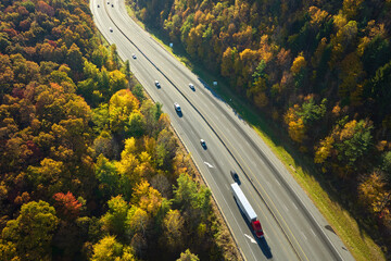 I-40 freeway road leading to Asheville in North Carolina over Appalachian mountain pass with yellow...