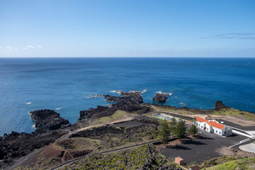 Fototapeta na wymiar Aerial view of Ferraria with the Atlantic Ocean in Background. Thermal waters at Ponta da Ferraria, thermal waters in the sea and natural hot water pools. São Miguel island in Azores