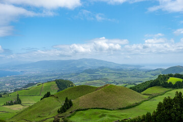 Panoramic view of the rolling hills and pure green fields of the Azores. São Miguel island in the Azores.