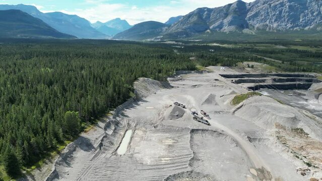 Aerial Drone footage over a quarry in the region of Banff. Near Banff national park looking over the mountains and vast forest landscape