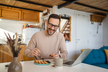 man adult caucasian have biscuits and marmalade for breakfast at home