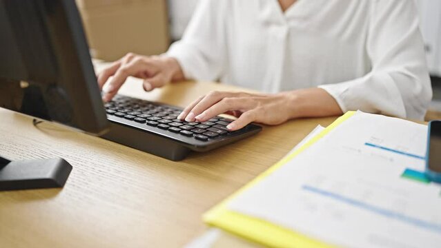 Young beautiful hispanic woman ecommerce business worker using computer at office