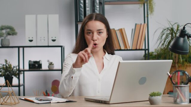 Caucasian young business woman working on laptop computer shakes finger, saying No be careful scolding and giving advice to avoid danger mistake disapproval sign at office. Confident freelancer girl