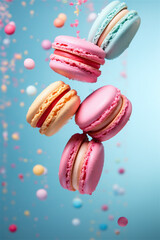 French macarons flying in the air on blue background. Levitation concept. food background. Pastel color. deconstruction food.