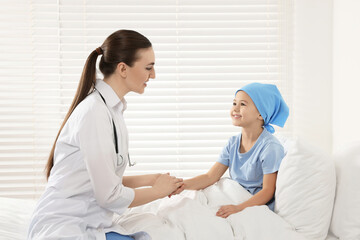 Fototapeta premium Childhood cancer. Doctor and little patient in hospital