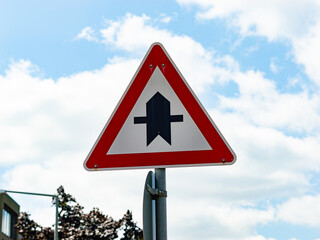 Right of way traffic sign next to a street in Germany. The symbol tells the user that this road has...