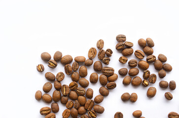 Coffee beans roasted spread on a white background is a medium roast, the coffee taste is medium intensity. Slightly sweet and sour, suitable for both hot and cold coffee.      