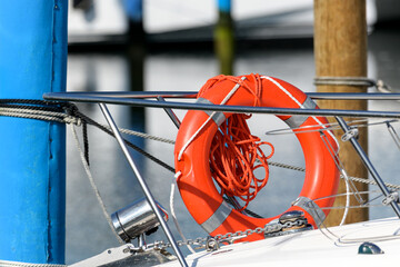 sport boat railing orange life ring safety