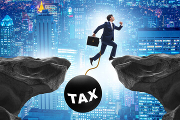 Concept of tax burden with businessman over chasm