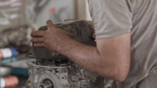 Car Engine Crankcase Cover Replacement in the Repair Shop Footage.