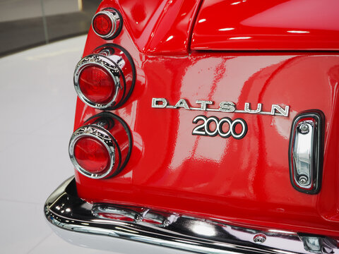 TOKYO, JAPAN - July 13, 2023: Detail of the back of a Datsun 2000 Sports on display at Nissan Crossing showroom in Ginza.