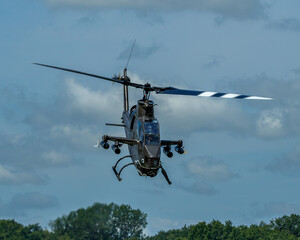 Fototapeta na wymiar Cobra attack helicopter in flight head on nose down