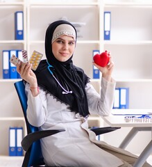Young doctor in hijab working in the clinic