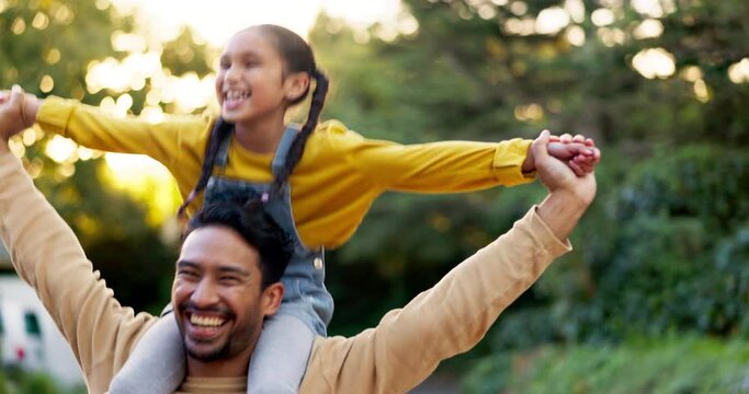 Happy, walking and a father and child in nature during sunset for bonding, care and love. Smile, holding and a young dad carrying a girl in a park or countryside, playing and laughing together