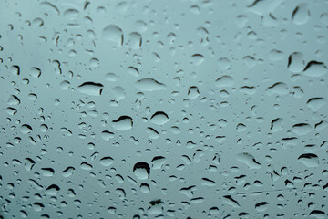 Water drops on car windscreen background.
