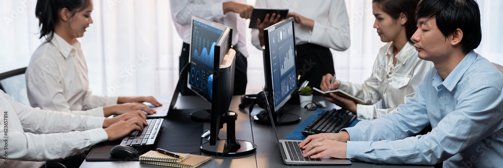 Poster analyst working on data analysis or bi dashboard on computer monitor. business team analyzing financ