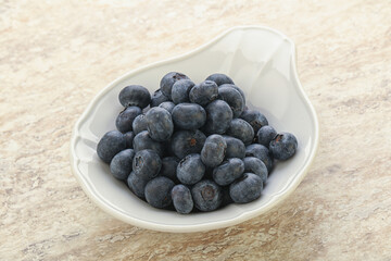 Sweet ripe blueberry heap in the bowl