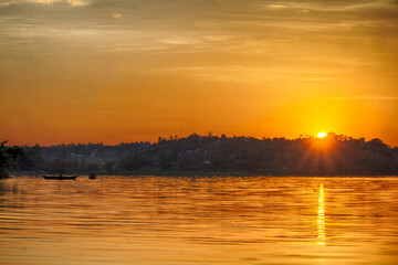 Sun rises on Lake Victoria near the village of Seme in western Kenya. 