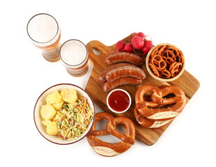 Glasses of cold beer and different snacks on white background. Oktoberfest celebration