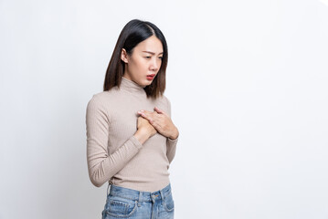 Portrait of sick stressed worried asian woman in checkered shirt clutching chest suffering sudden...