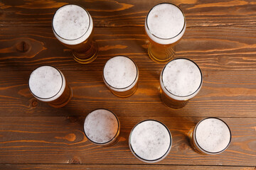 Glasses of cold beer on wooden background. Oktoberfest celebration