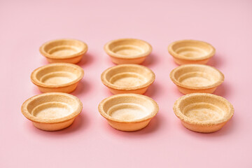 Homemade tartlets on pink background