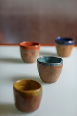 Ceramic cups on the white table