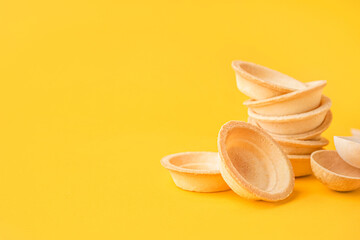 Homemade tartlets on yellow background