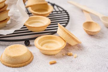 Grid with homemade tartlets on white background