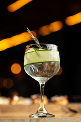 Delicious cocktail in a restaurant, with a black background and lights.