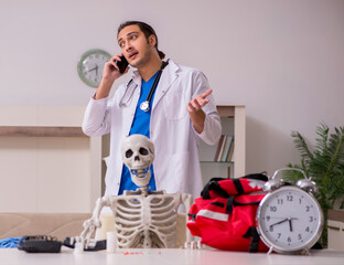 Young male paramedic visiting skeleton patient