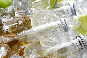 Refreshing Chill: Close-Up of  Cold Beer Glass Bottles Nestled in Ice Pieces, Inviting a Cool Sip in 4K Resolution