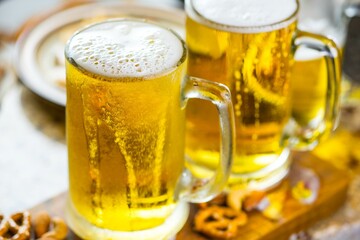 Refreshing Pour: Close-Up of Pouring and Serving Cold Beer into a Glass, Showcased in Crisp 4K Resolution