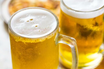 Refreshing Pour: Close-Up of Pouring and Serving Cold Beer into a Glass, Showcased in Crisp 4K Resolution